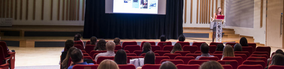 female presenter and audience