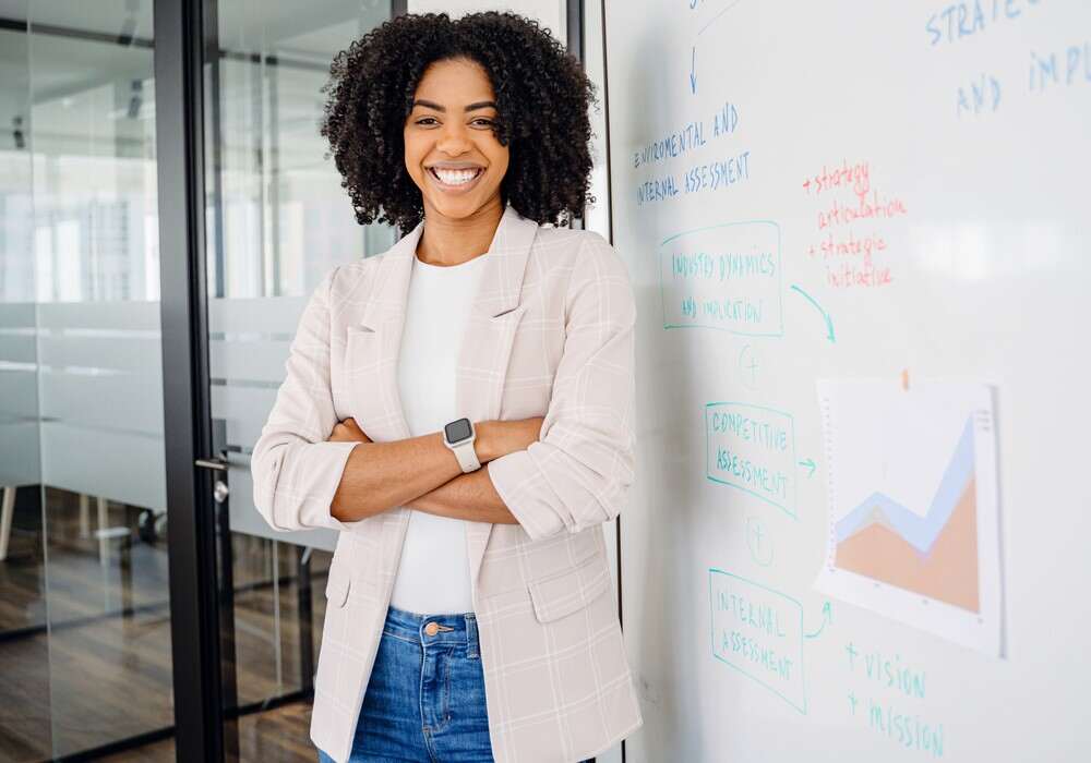 Woman stood by a whiteboard