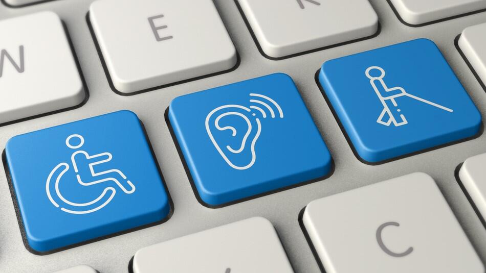 A computer keyboard with disability symbols on some of the keys