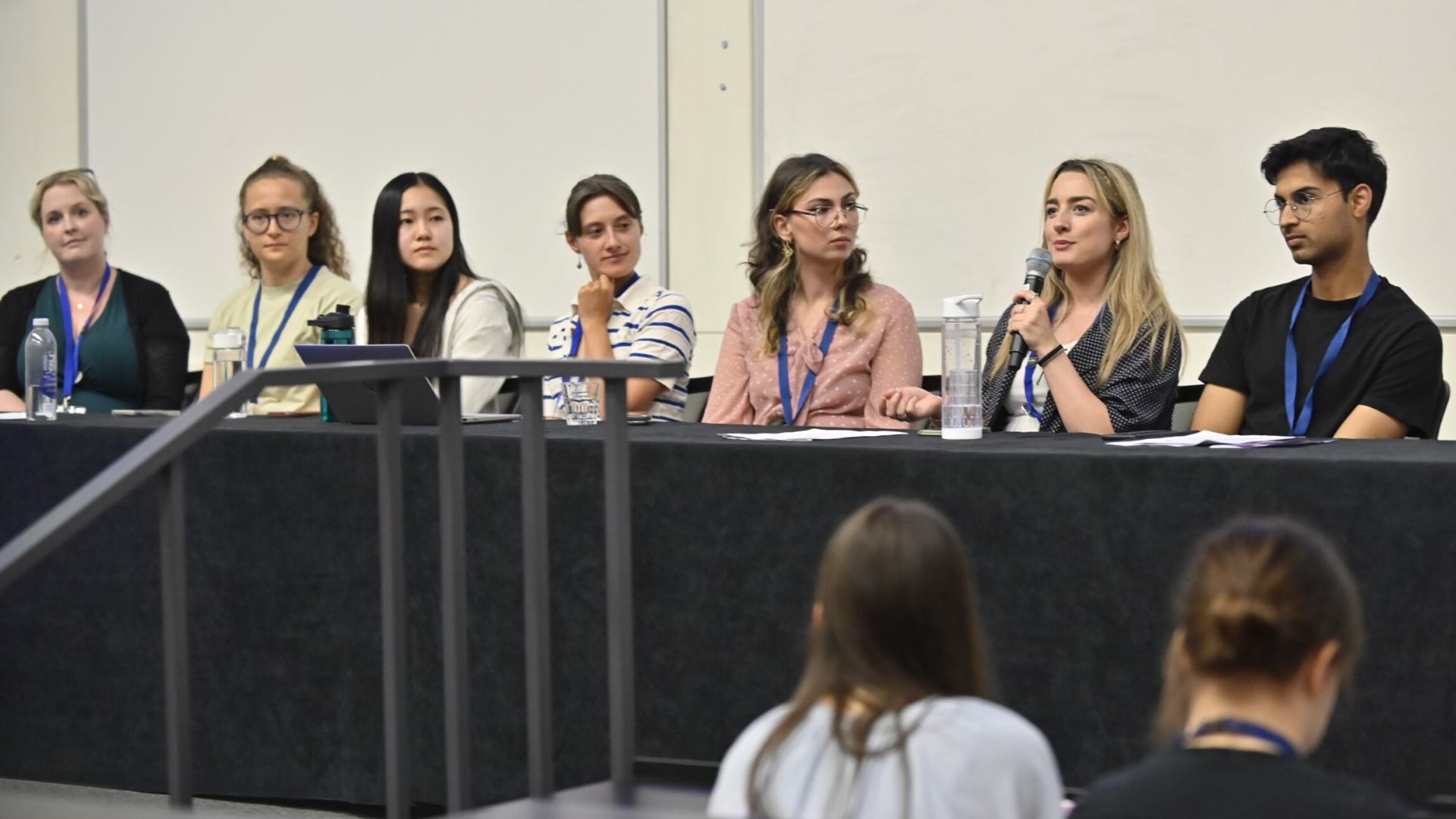 An image of speakers at the first plenary session of the conference.