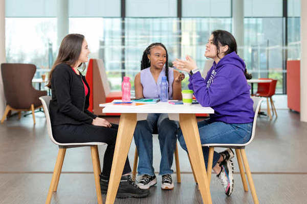 Students talking at table